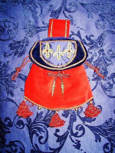 Red and blue velvet pouch with classic fleur-de-lys reproduced in goldwork