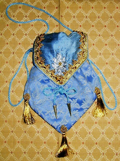 Pale blue brocade pouch with goldwork on silk