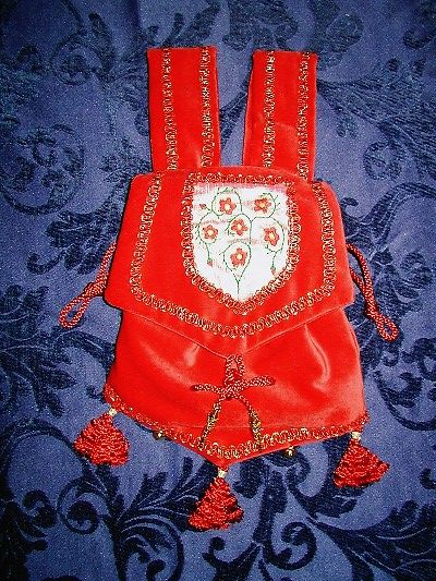 Red velvet pouch with goldwork and silkwork reproduced from the Manesse Codex