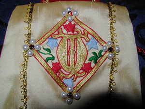 Detail of Goldwork Lombardic 'W', with silkwork Vine Leaves