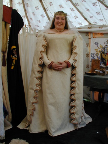 Jennie in her Full Circle Cream Brocade Wedding Dress, with hanging Dagged Sleeves, lined throughout in Burgundy Brocade, before the Wedding